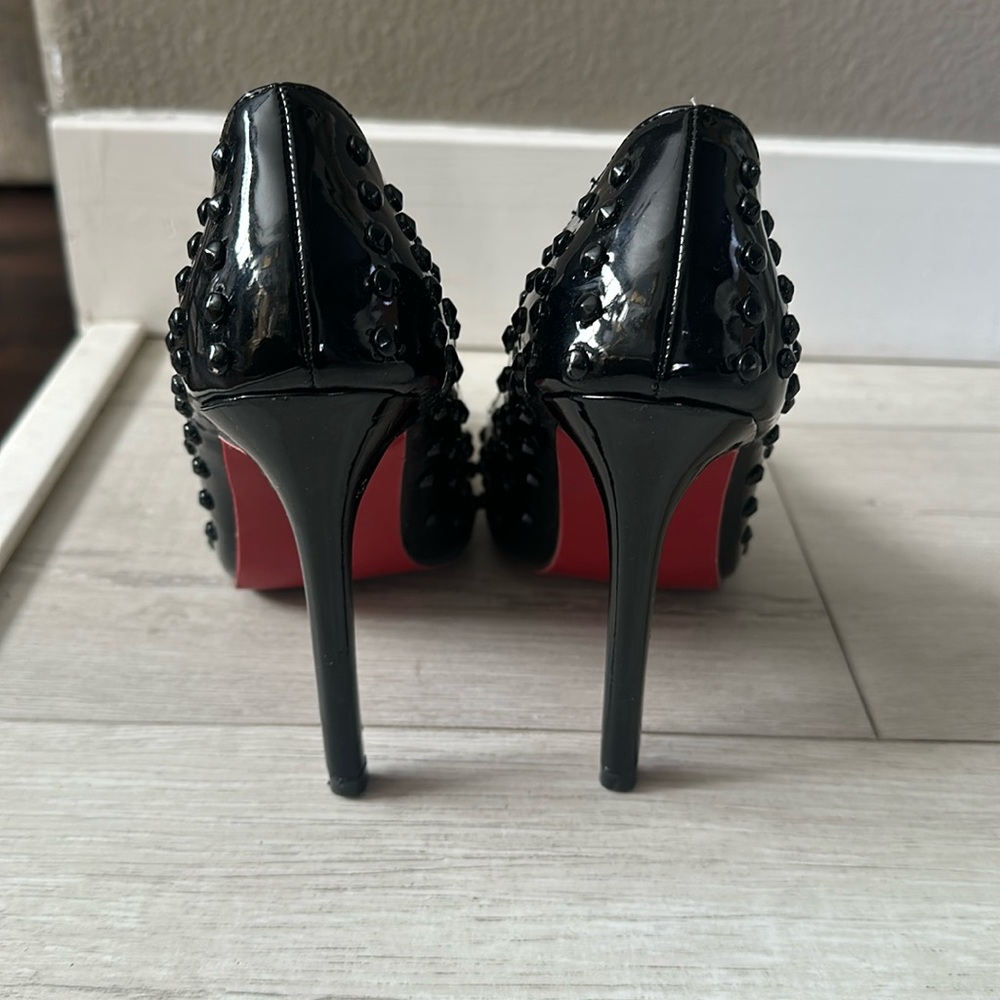Black studded pointed toe heel